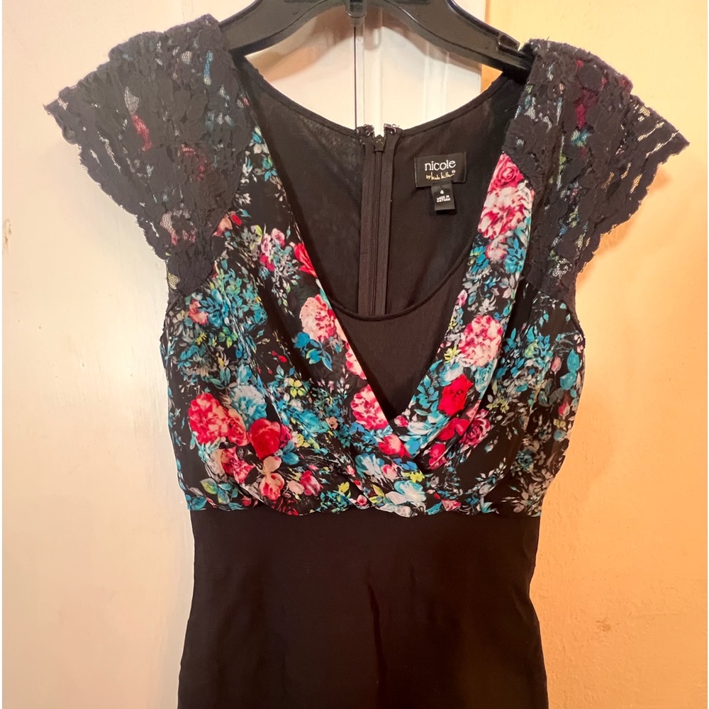 Nicole Miller dress. Size 4 stretch skirt black multi color blouse.